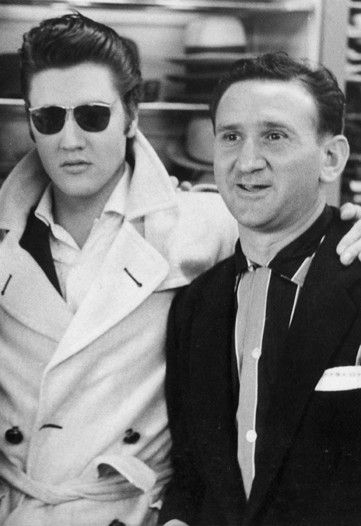 Bernard J. Lansky and Elvis Presley in Lansky Bros. shop in Memphis. Circa 1950s.