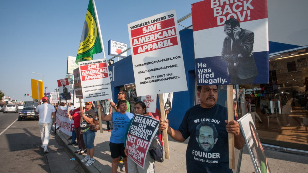 Workers demonstrate outside American Apparel’s store on Melrose Avenue
