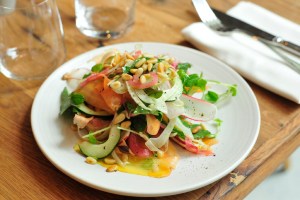 Shaved vegetable plate with zucchini, carrots, olives and citrus dressing