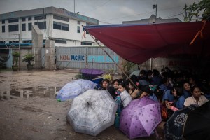 Factory workers listen to their Union Leader speak on October 13, 2015. On August 29 2015, the government of Myanmar announced a minimum wage of 3,600 kyats (about 3 US$). This slight pay raise was met with hostilities by factory owners in the Garment Industries who either refused to increase pay at all, made layoffs to keep expenses the same or cut overtime pay and benefits. Even those garment factory workers who have seen a increase in their daily wages have seen very little change in their salaries overall.