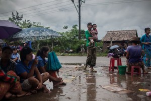 Factory workers listen to their Union Leader speak on October 13, 2015. On August 29 2015, the government of Myanmar announced a minimum wage of 3,600 kyats (about 3 US$). This slight pay raise was met with hostilities by factory owners in the Garment Industries who either refused to increase pay at all, made layoffs to keep expenses the same or cut overtime pay and benefits. Even those garment factory workers who have seen a increase in their daily wages have seen very little change in their salaries overall.