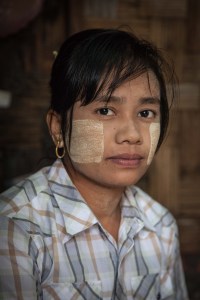Khin Mar Wai, 28, posed for a portrait near her dormitory on October 13, 2015. She worked at North Shore factory before being laid off around the time of the minimum wage announcement. On August 29 2015, the government of Myanmar announced a minimum wage of 3,600 kyats (about 3 US$). This slight pay raise was met with hostilities by factory owners in the Garment Industries who either refused to increase pay at all, made layoffs to keep expenses the same or cut overtime pay and benefits. Even those garment factory workers who have seen a increase in their daily wages have seen very little change in their salaries overall.