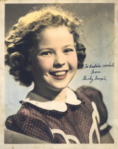 Hand-colored studio portrait of Shirley Temple