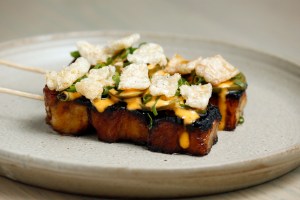Pork belly anticucho with char siu, pickled chilis, spicy mayo.