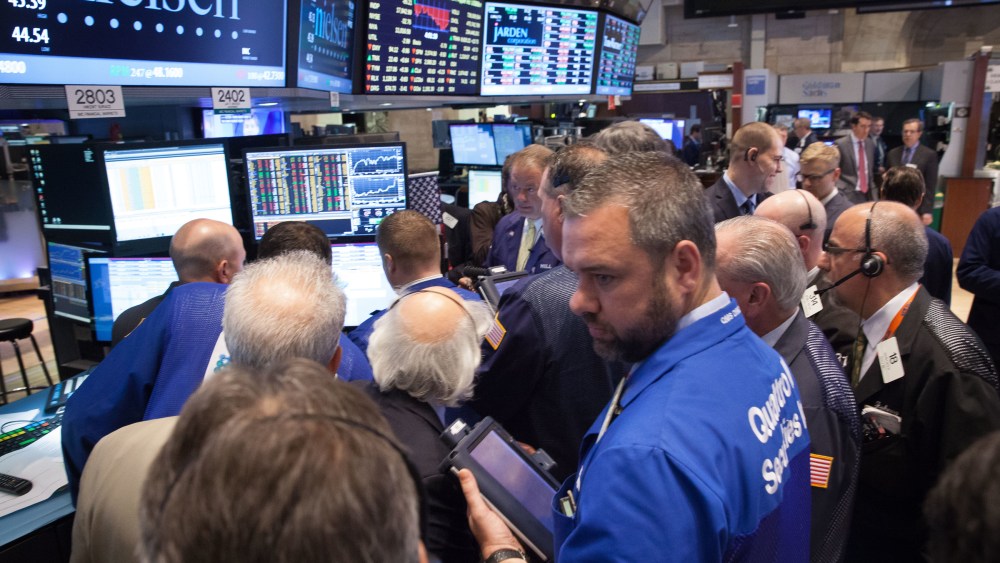 Traders work on the floor of the New York Stock Exchange.