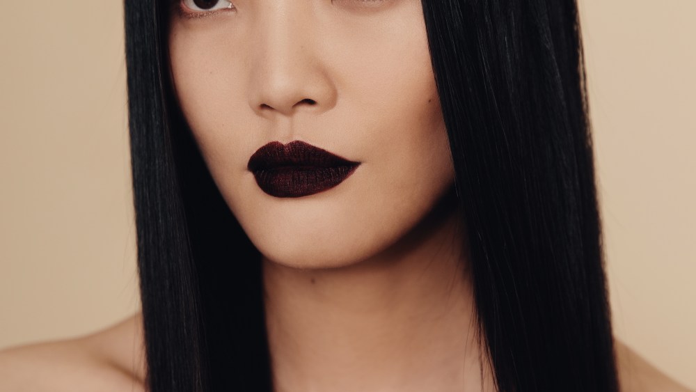Backstage Makeup Artists Focus On Models' Unique Features