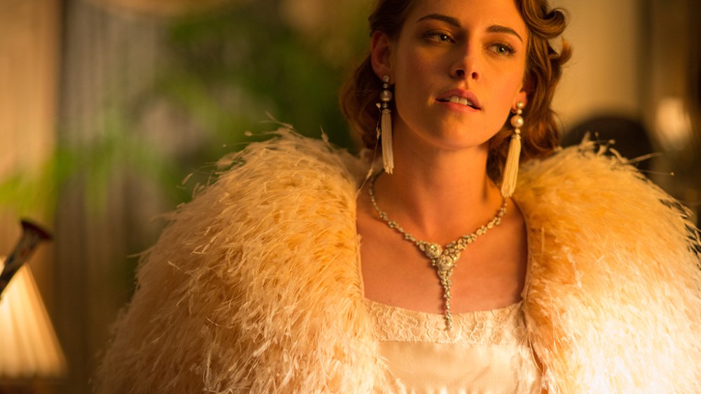 A still from "Cafe Society" showing Kristen Stewart in a custom-made light pink silk and lace Chanel dress and Chanel fine jewelry