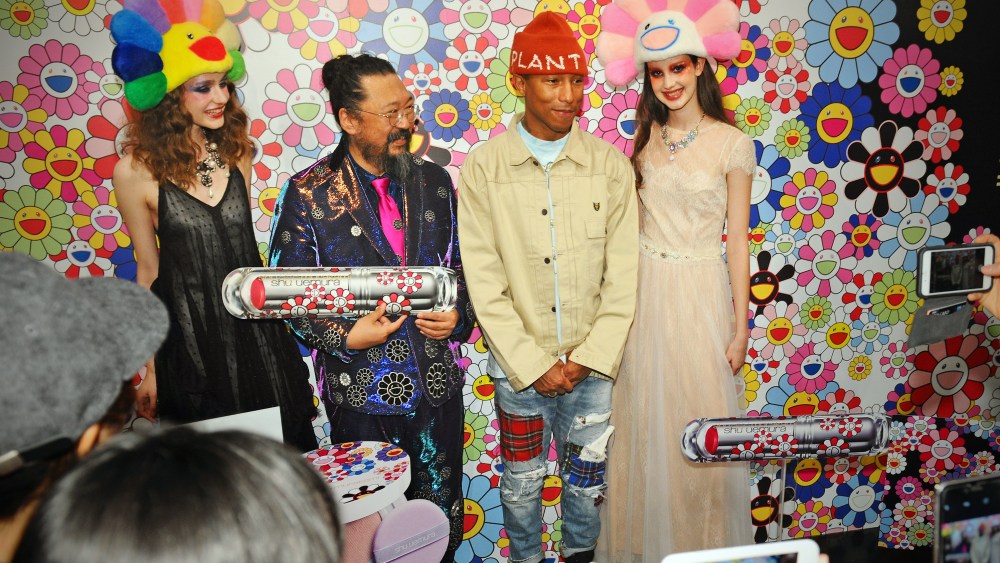 Takashi Murakami and Pharrell Williams with models.
