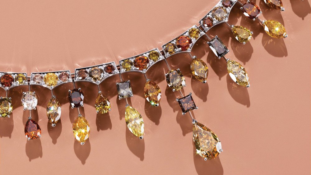 De Beers’ 18-karat white gold necklace with multicolored diamonds.