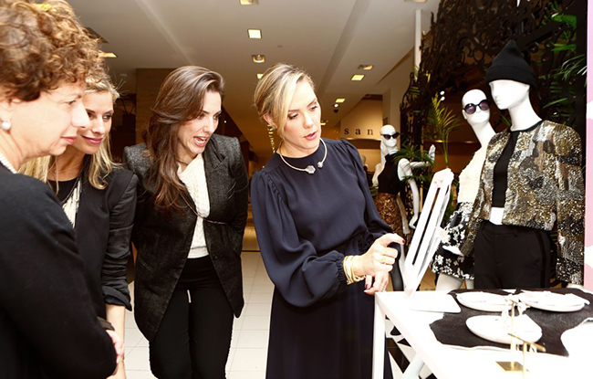 Kendra Scott, right, celebrates the 2015 launch of her brand in Bloomingdale's in New York.