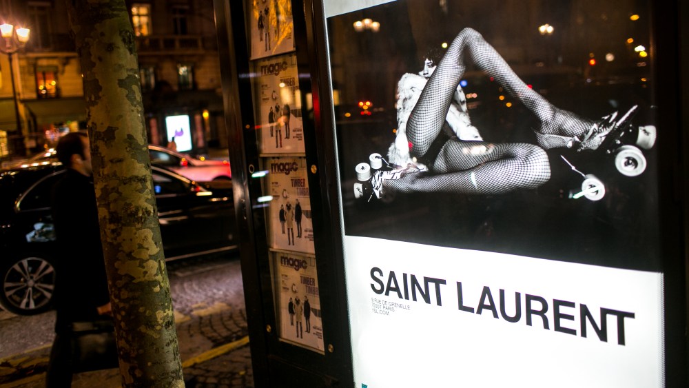 One of the controversial YSL ads is displayed on a Paris newsstand.