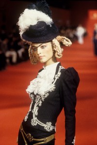 Black princess-sleeve calf-length skirtsuit with contrasting white soutache trim and ruffled shirt in the Givenchy Spring/Summer 1997 Ready-to-Wear collection designed by John Galliano in Paris