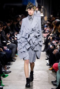 A model on the runway at the Comme Des Garcons fall 2013 show.
