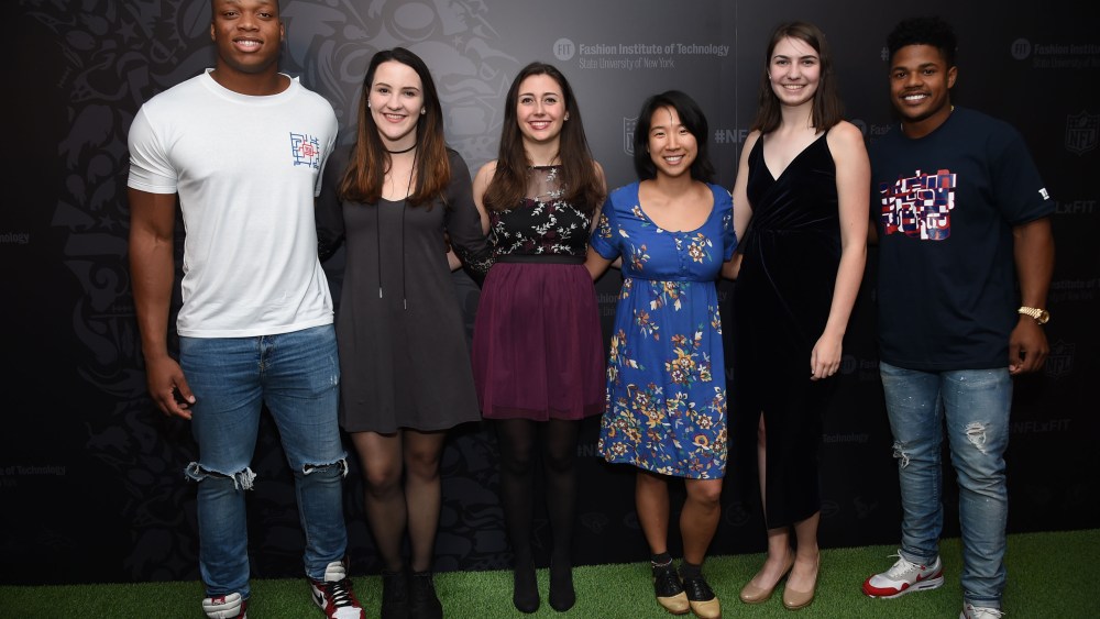 NFL players Romeo Okwara, left, Sterling Shepard, far right, pose with FIT students at the NFLxFIT Visual System Design Contest and Exhibition at The Museum at FIT on Tuesday, April 18, 2017, in New York. (Photo by Evan Agostini/Invision for The Fashion Institute of Technology/AP Images)