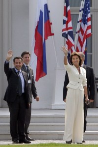 French President Nicolas Sarkozy, left, and his wife Cecilia waves as they arrive in Heiligendamm,  Germany, Wednesday, June 6, 2007. The leaders of the G8 nations will hold their annual summit in the historic Heiligendamm sea resort on June 6-8, 2007. (AP Photo/Christophe Ena,Pool)