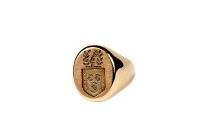 Material: goldMeasurement: 1 inch Description: Man's ring with an oval face engraved with the Kennedy Crest. This ring was a gift from Jacqueline Kennedy to her husband, John F. Kennedy on his birthday in 1961.