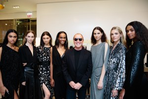 Michael Kors with models in his looks.