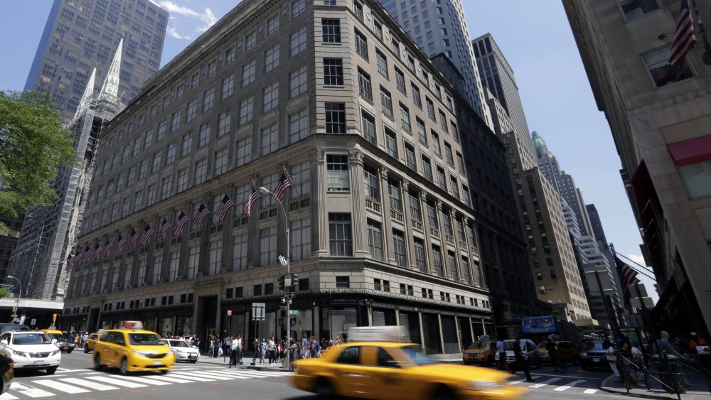 Taxis pass Saks flaship store on New York's Fifth Avenue, . Saks Inc. agreed to sell itself to Hudson's Bay Co., the Canadian parent of upscale retailer Lord & Taylor, for about $2.4 billion in a deal that will bring luxury to more North American localesSaks Acquisition, New York, USA