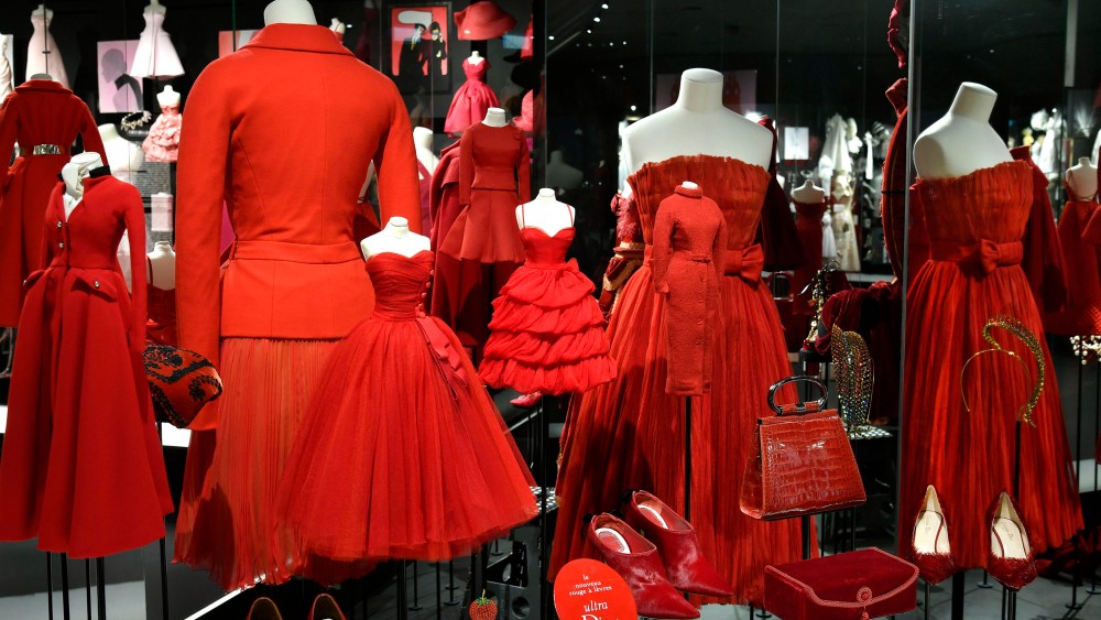 Designs by Raf Simons, John Galliano, Christian Dior and Marc Bohan in a chromatic display in the Dior exhibition at Les Arts Décoratifs.  