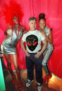ANDRE VAN PIER Designer/actor Andre Van Pier, center, poses with two of his models following a "Top Secret Area 51" fashion show featuring extraterrestrial and UFO fashions and "Alien"sportswear, in New York. The fashion show is a preview of the Roswell East Festival, being held in New York Wednesday, July 9. All of a sudden space-related phenomena are arranging themselves in popular culture like aligned planetsSPACE INVASION, NEW YORK, USA