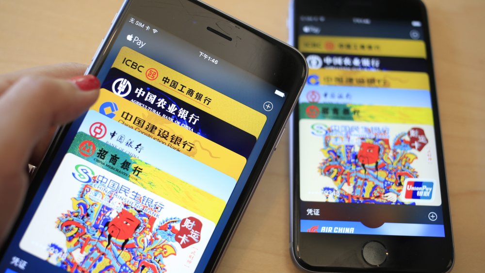 Apple Pay Apps Run on Iphones in an Apple Store in Beijing China 18 February 2016 Us Electronics Giant Apple Inc Launched Its Mobile Payment Service Apple Pay in China Amid Strong Competition From Local Players Like Wechat Payment and Alipay China BeijingChina Apple Pay - Feb 2016