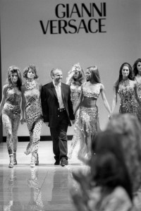 Outtake; Designer Gianni Versace walks down the runway of his Spring 1991 show, holding hands with super models (from left) Stephanie Seymour, Linda Evangelista, Tatjana Patiz, Naomi Campbell and Cindy CrawfordArticle title: "Gianni Shines"