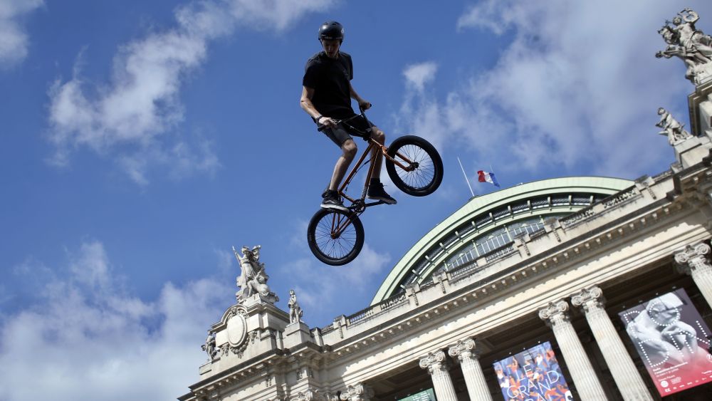 Belgian biker Kenneth Tancre performs outside the Grand Palais museum in Paris, . Paris is aiming to boost its bid for the 2024 Olympics by turning some of its world-famous landmarks over to sports for two days, with 100-meter races on a track floating on the Seine, high-diving into the river, cycling around the Arc de Triomphe and other events to showcase the French capital's suitability for the games2024, Paris, France - 23 Jun 2017