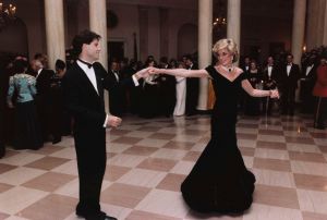 In this Nov. 9, 1985 photo provided by the Ronald Reagan Library, actor John Travolta dances with Princess Diana at a White House dinner in Washington. This outfit is featured in an exhibition of 25 dresses and outfits worn by Diana entitled "Diana: Her Fashion Story" at Kensington Palace in London, opening onBritain Fashion Diana Dresses, WASHINGTON, USA - 3 Jan 2005