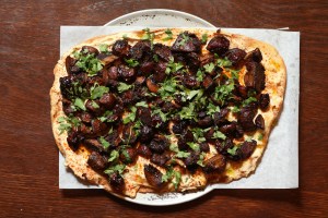 Flatbread with roasted mushroom and pearl onion bahara.