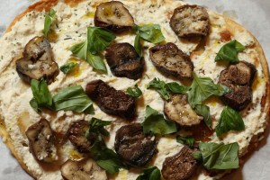 Flatbread with almond ricotta, slow roasted eggplant and house miso tahini.