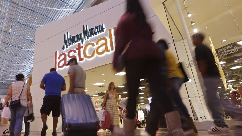 Shoppers walk by a Neiman Marcus department store on Black Friday in Miami, . Stores open their doors Friday for what is still one of the busiest days of the year, even as the start of the holiday season edges ever earlierHoliday Shopping Black Friday, Miami, USA - 25 Nov 2016