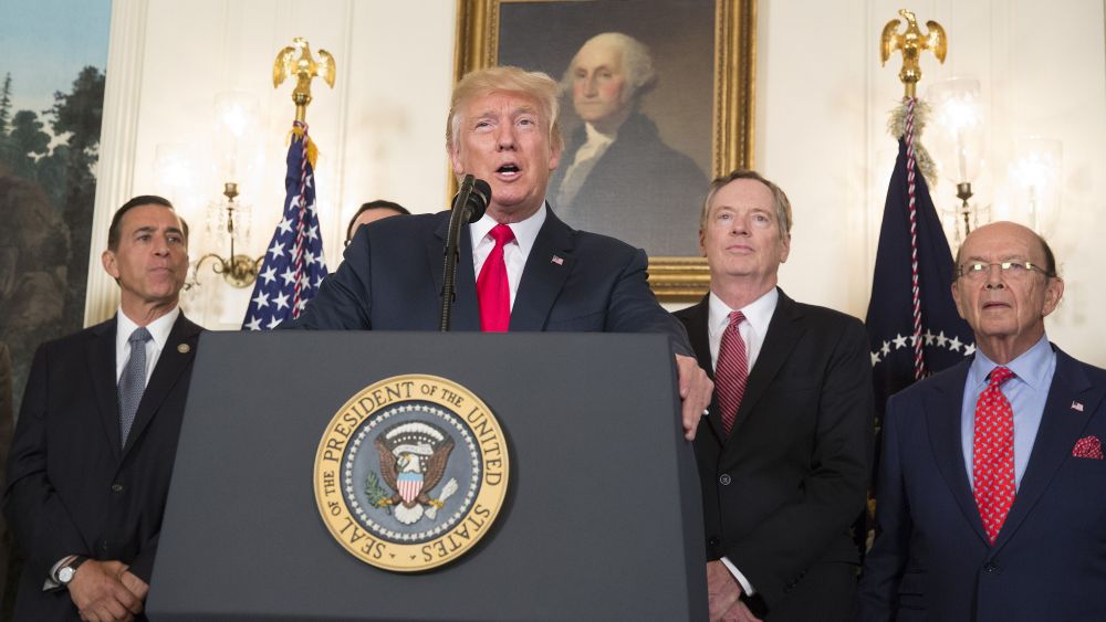 United States President Donald J. Trump speaks before signing a memorandum on addressing China's laws, policies, practices, and actions related to intellectual property, innovation, and technology at The White House in Washington, DC,. Pictured from left to right is US Representative Darrell Issa (Republican of California), US Trade Representative Robert Lighthizer, and Us Secretary of Commerce Wilbur Ross.Trump Remarks at Signing of Memorandum on China Trade, Washington DC, USA - 14 Aug 2017