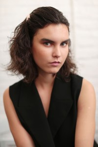Miki Ishida for Shiseido created an almost-sunburnt beauty look, piling bronzer and tawny blush across models cheeks all the way to the nose, with an orangey-brown shadow on the lower lash line. "Skin was left matte, with a kind of dusty tone," Ishida said. She also pulled in products from Shiseido subbrand Playlist (not yet available in the U.S., she said), one that served as a matte lip primer, and one as a purple lip-color corrector. This season is more about pairing matte lips with matte skin, or glossy lips with dewy skin, Ishida said. "Two of dewy or matte [and you don't mix them]."