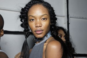 Channeling nature, Kien for Oribe created two strict braids that framed models' faces, with a third braid tied into a ponytail. "What we wanted to do was do a braid, but it's really about the direction of the braid, where it's almost like a volcanic situation into a tight fitting cornrow, and then afterwards we're going to pull and roughen up the braids so it's nice and airy and roughened up - as if the volcano has had an explosion." Models with curls had their natural texture enhanced with Foundation Mist, Royal Blowout and Shine Spray "to enhance the curls," Kien said.