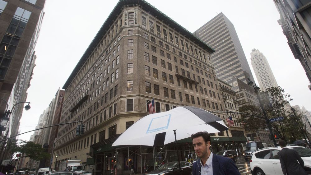 A man walks past the Lord & Taylor flagship store, in New York. The store, known for its holiday displays along Fifth Avenue, is being sold to the office space sharing company WeWork. The nearly 100-year-old building will be converted to WeWork headquarters, with less than a quarter of the space remaining for a Lord & Taylor store. Ten of the building's 11 floors are now devoted to retailLord Taylor Flagship-WeWork, New York, USA - 24 Oct 2017
