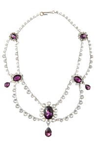 A multi-strand, tiered necklace with bezel set iridescent stones, and eight simulated amethysts.  Worn by Vivien Leigh in "Gone With The Wind" (Selznick International Pictures, 1939).