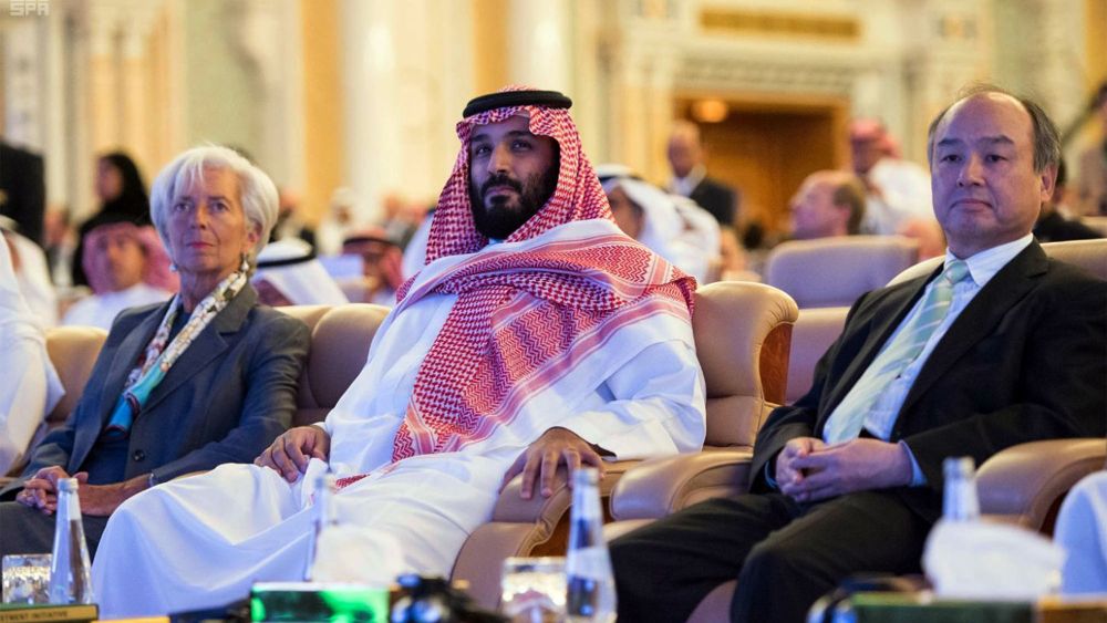 In this photo released by Saudi Press Agency, SPA, Saudi Crown Prince Mohammed bin Salman, center, and Managing Director of the International Monetary Fund Christine Lagarde, left, attend the opening ceremony of Future Investment Initiative Conference in Riyadh, Saudi Arabia, . Saudi Arabia's powerful crown prince on Tuesday announced plans to build a futuristic city run entirely on alternative sources of energy and said the ultraconservative kingdom must return to "moderate IslamInvestment Conference, Riyadh, Saudi Arabia - 24 Oct 2017