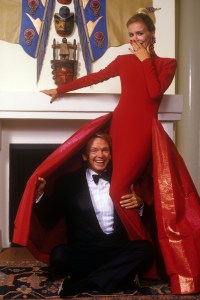Fashion designer Bob Mackie with models wearing his eveningwear designs, 1987.