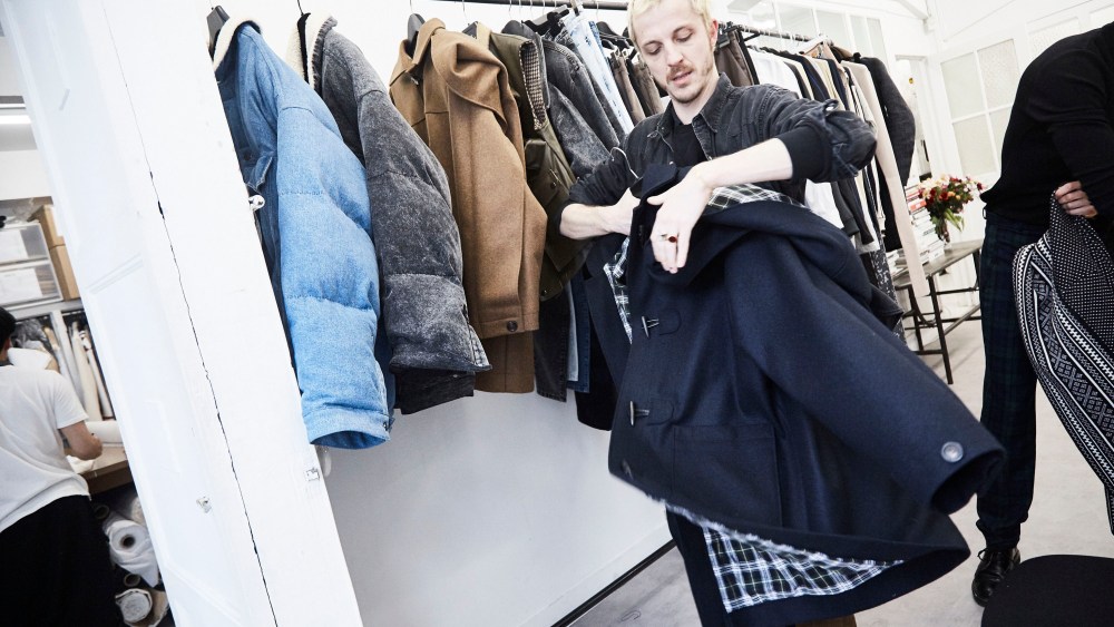 Glenn Martens preps a pea coat at  Y/Project.