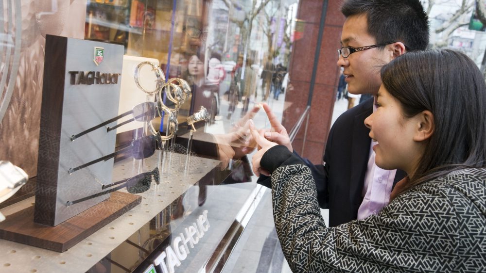 Chinese shoppers peruse a Tagheuer display on Shanghai's Nanjing Road West.