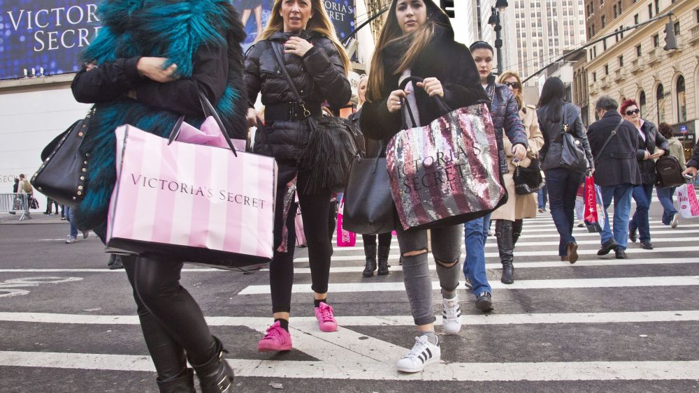 Holiday Shopping Shoppers carry bags as they cross a pedestrian walkway near Victoria Secret in Herald Square, in New York. The early numbers aren't available yet on how many shoppers headed out to stores on Thanksgiving, instead of waiting until today. But it's expected that more than three times the number who shopped yesterday will be out bargain-hunting todayHoliday Shopping, New York, USA