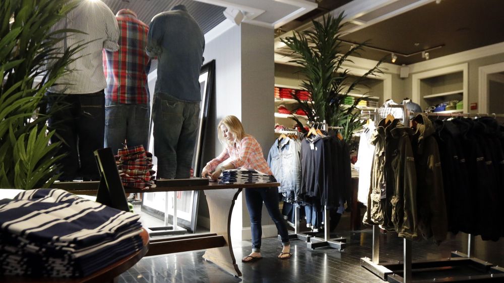 A woman works at an Abercrombie & Fitch store in Chicago. The government reports how much consumers spent and earned in March on Monday, April 29, 2013Consumer Spending, Chicago, USA