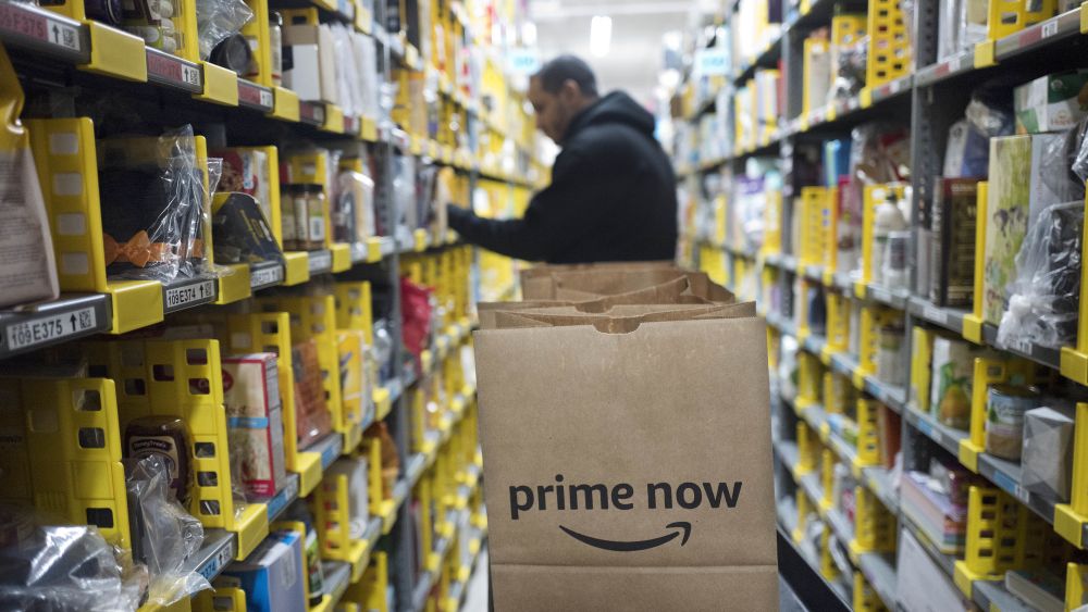 A clerk reaches to a shelf to pick an item for a customer order at the Amazon Prime warehouse, in New YorkHoliday Shopping-Procrastinators Dream, New York, USA - 20 Dec 2017
