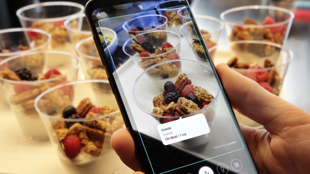 The Bixby virtual assistant software of a Samsung Galaxy S9 Plus mobile phone identifies food and displays its calorie content during a product preview in New York. The Galaxy S9 phones were unveiled Sunday, Feb. 25, in Barcelona, Spain, and will be available March 16. Advance orders begin this FridaySamsung New Phones, New York, USA - 21 Feb 2018