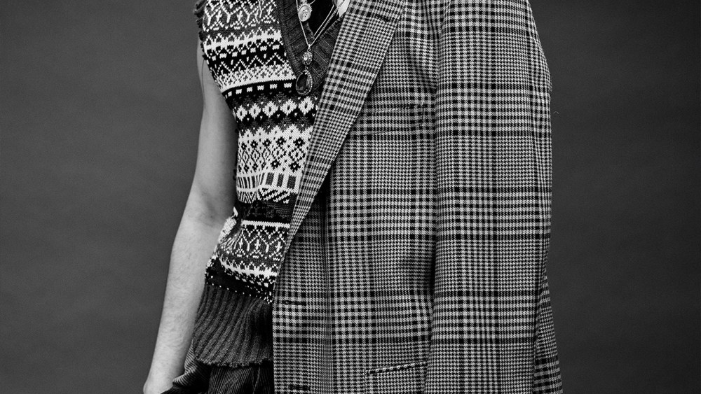 Dries Van Noten's wool coat; MSGM's wool sweater vest; Brooks Brothers' cotton shirt and Brunello Cucinelli's cotton blazer around waist and pants.