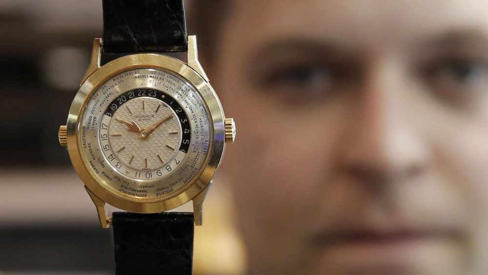 Asia has become a bright spot once again for the watch business. Above, Sam Hines, the global head of watches for Sotheby's holds up a timepiece.