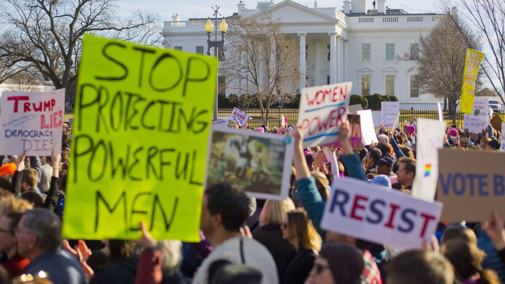 Women's March demonstrators walk past the White House in Washington, . On the anniversary of President Donald Trump's inauguration, people participating in rallies and marches in the U.S. and around the world Saturday denounced his views on immigration, abortion, LGBT rights, women's rights and moreWomens Marches, Washington, USA - 20 Jan 2018