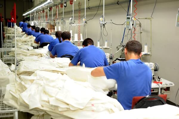 workers sewing clothes in a garment factory