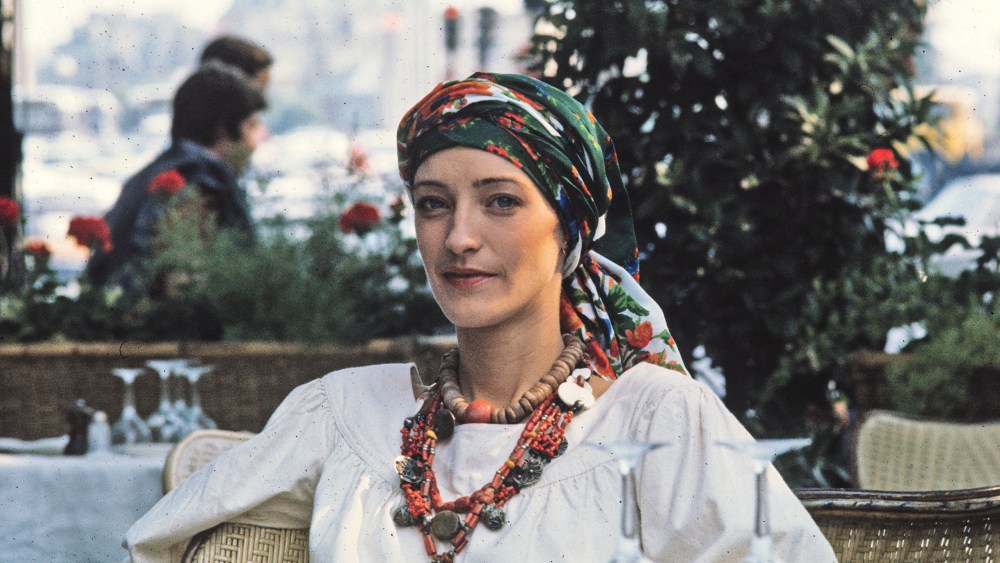 Loulou de la Falaise sitting in an outdoor cafe, 1976.