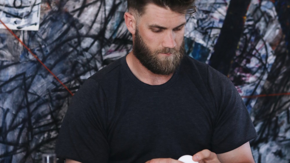 Bryce Harper working on his new collection with the Blind Barber.
